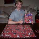 Me making a funny face & posing with the tragically defeated cow puzzle.